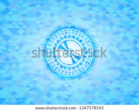 CD or DVD disc icon inside realistic sky blue mosaic emblem