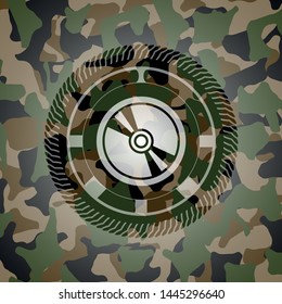 CD or DVD disc icon on camouflaged texture