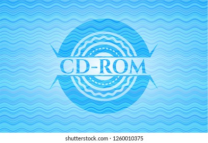 CD-ROM light blue water wave emblem background.