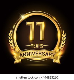 Celebrating 11 years anniversary logo with golden ring and ribbon, laurel wreath vector design.