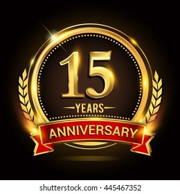 Celebrating 15 years anniversary logo with golden ring and red ribbon.