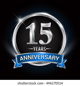 Celebrating 15 years anniversary logo with silver ring and blue ribbon.