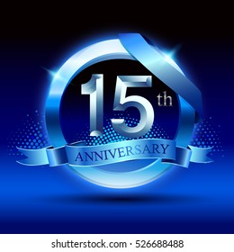 Celebrating 15 years anniversary logo. with silver ring and blue ribbon,