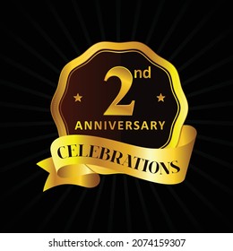 Celebrating 2 or second years golden anniversary  or 2nd anniversary logo celebration with with shiny ring and golden ribbon