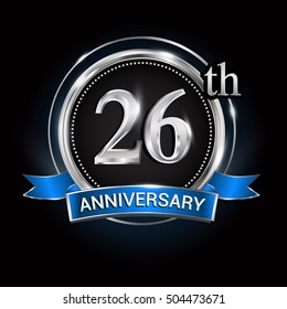 Celebrating 26th anniversary logo. with silver ring and blue ribbon.
