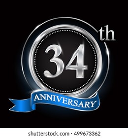 Celebrating 34th anniversary logo. with silver ring and blue ribbon.