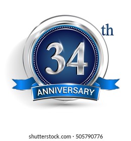 Celebrating 34th anniversary logo, with silver ring and blue ribbon isolated on white background.