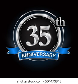 Celebrating 35th anniversary logo. with silver ring and blue ribbon.