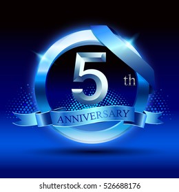 Celebrating 5 years anniversary logo. with silver ring and blue ribbon,