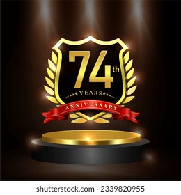 Celebrating 74 years anniversary logo with golden shield and ribbon, laurel wreath, cylinder podium vector design.