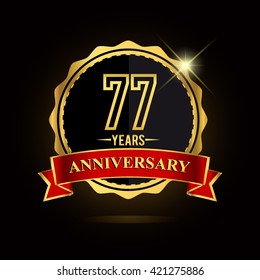 Celebrating 77 years anniversary logo with red ribbon and golden shiny badge, vector design.