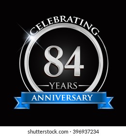 Celebrating 84 years anniversary logo. with silver ring and blue ribbon.
