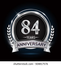 Celebrating 84 years anniversary logo. with silver ring and blue ribbon,