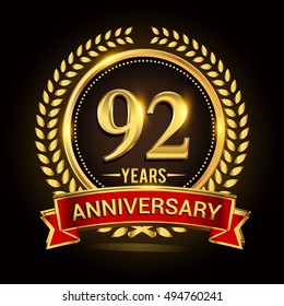 Celebrating 92 years anniversary with wreath, ribbon and golden ring logo.