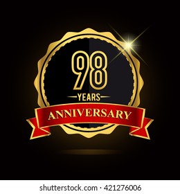 Celebrating 98 years anniversary logo with red ribbon and golden shiny badge, vector design.