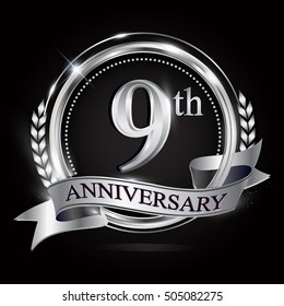 Celebrating 9th anniversary logo, with silver ring and ribbon.