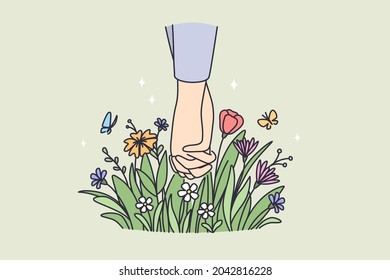 Celebrando el concepto de fiesta de San Valentín. Manos de pareja amada feliz sosteniendo manos con flores abajo y brotes florecientes ilustraciones vectoriales 