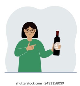 A celebrating woman holds a bottle of wine in his hand. Tasting or celebration concept.