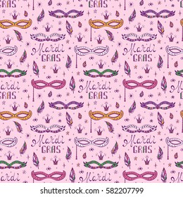 Celebration Carnival Seamless pattern. Mardi Gras Party. Hand drawn Mardi Gras lettering with Venetian masquerade mask, feathers and stars. Holiday Vector background