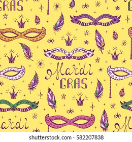 Celebration Carnival Seamless pattern. Mardi Gras Party. Hand drawn Mardi Gras lettering with Venetian masquerade mask, feathers and stars. Holiday Vector background