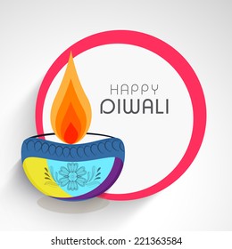Celebration of Diwali with illuminated oil lit lamp and stylish text of Happy Diwali.