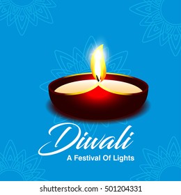 Celebration of Diwali with illuminated oil lit lamp and stylish text of Happy Diwali.