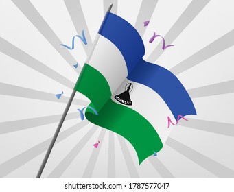 The celebration flag of Lesotho flies at height