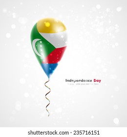 Celebration and gifts. Ribbon in the colors are twisted under the balloon. Independence Day. Balloons on the feast the national Flag of Comoros
