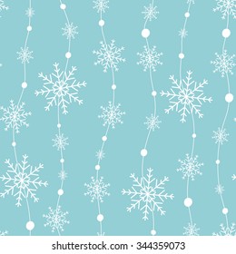 Celebratory pattern with snowflakes hanging on strings.