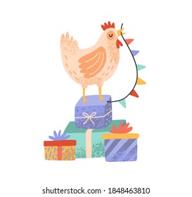 Celebratory rooster standing on pile of gift boxes and holding flag garland beak. Cute cockerel or hen with presents isolated on white background. Flat vector cartoon illustration of cute cock