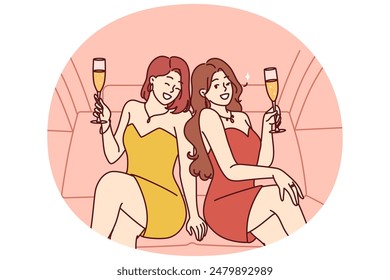 Celebrity women sit in luxury car with glasses filled with sparkling wine during pre-wedding bachelorette party. Celebrity girls in evening dresses riding in limousine enjoy premium atmosphere