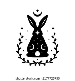 Celestial animal silhouette of sitting back rabbit. Magic bunny with natural elements. Black magical bunny rabbit, mystic crescent moon esoteric symbol, constellation elements. Vector rabbit for decor