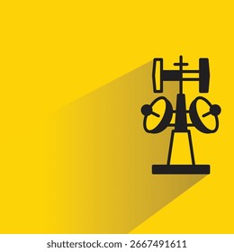 cell site network tower with shadow on yellow background