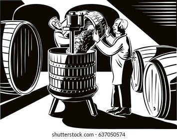 Cellar with big barrels, a young man pays of ripe grapes, freshly picked, in a press for crushing.
