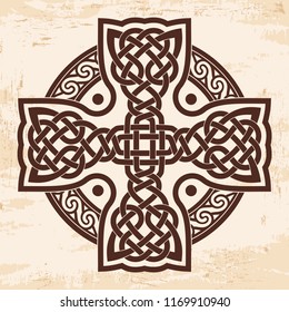 Celtic national cross with ornament interlaced ribbon. Image on a beige background with the effect of aging.