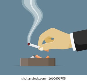 ceramic ashtray full of smokes cigarettes. Crockery for smoking. Cigarette in hand.