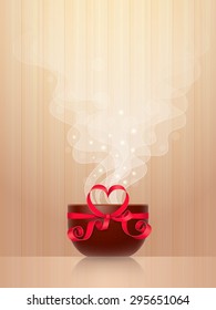Ceramic cup, tied by red ribbon with heart-shaped bow, light steam on wooden background. Favourite drink concept