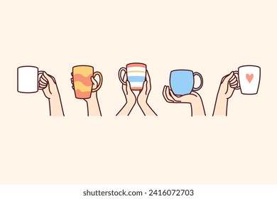 Ceramic cups with different patterns in people hands, for drinking coffee or tea and other hot drinks. Cups mugs for tea and coffee breaks with friends, or creating comfortable atmosphere in cafeteria