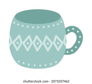 taza verde de cerámica, decorada con adornos geométricos