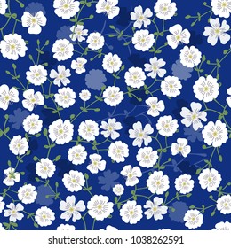 Cerastium pattern with small flowers intertwined on a blue background. For textiles, background, decor, decoration, postcards, holiday, greetings.