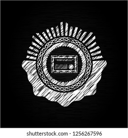certificate icon inside chalk emblem written on a blackboard