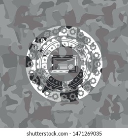 certificate icon inside grey camouflage emblem
