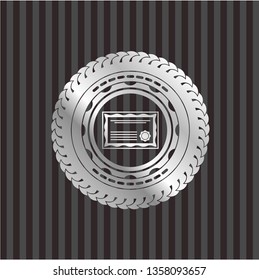 certificate icon inside silvery emblem or badge
