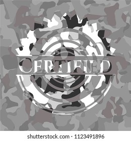 Certified on grey camouflaged pattern