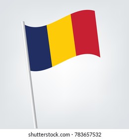 Chad flag waving isolated vector illustration,vector waving simple triangle Chadian flag on pole - national symbol of Chad with inclined metal stick.