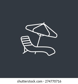 Chair and beach umbrella