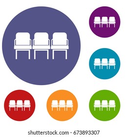 Chairs in the departure hall at airport icons set in flat circle reb, blue and green color for web