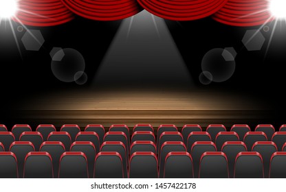 chairs and spotlight on the stage in the hall