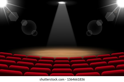 chairs and stage with spotlight in the hall