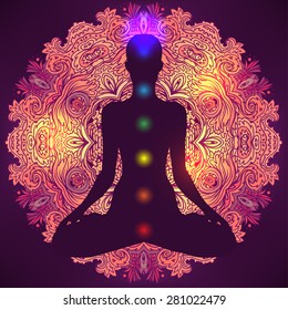 Chakras concept. Silhouette in lotus position over colorful ornate mandala. Vector illustration.